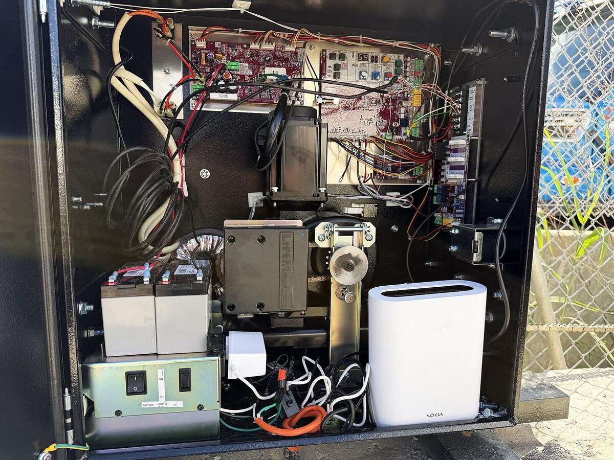 Automatic gate operator with control boards, batteries and backup power