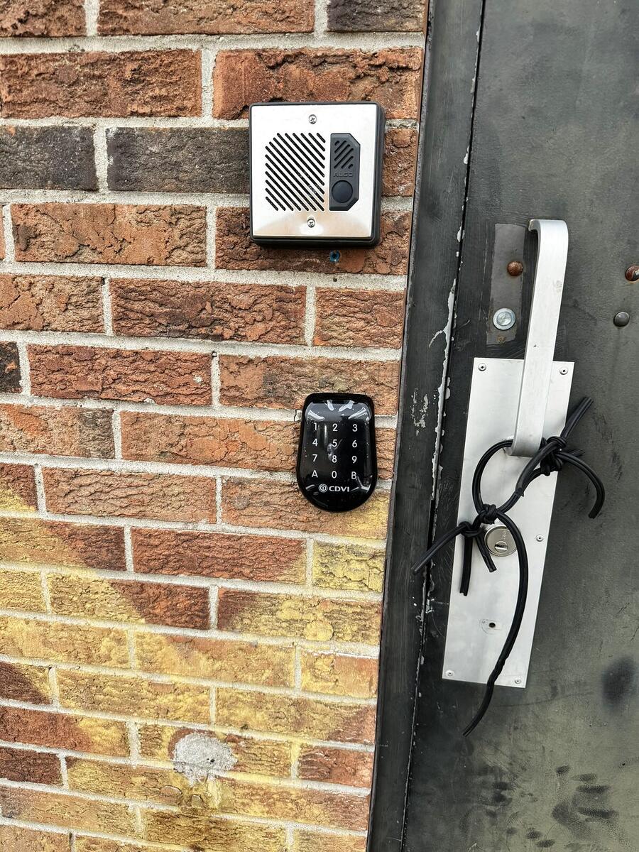 Keypad entry and intercom installed beside a commercial door by RM Security Services